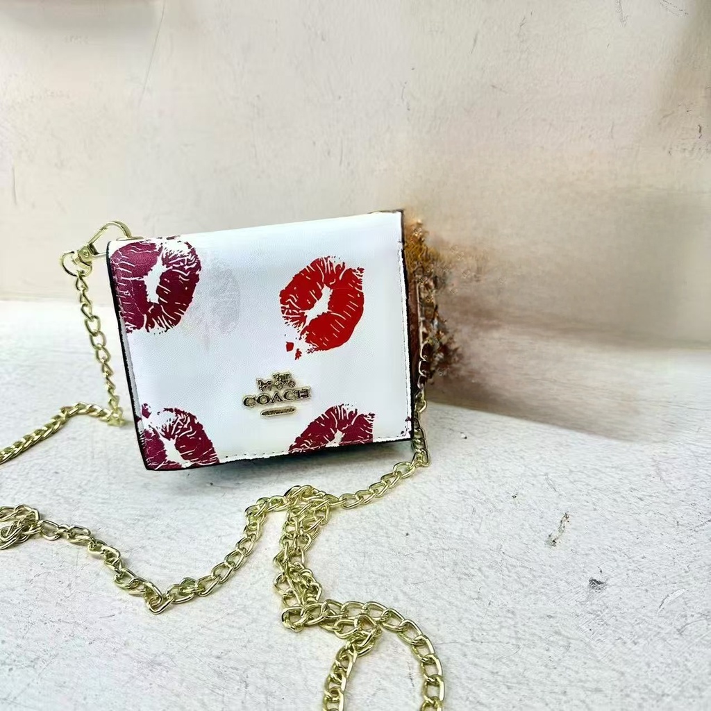 [3801260395] Billetera Cruzada Coach BESOS